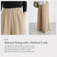 Beige wide-leg pants with gathered elastic waistband and pleated front