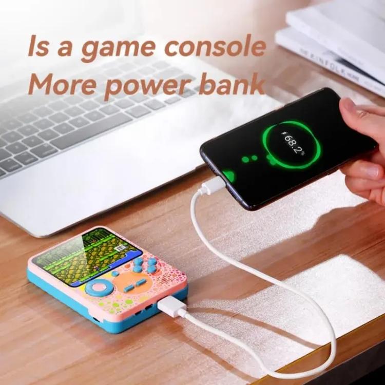 Colorful handheld game console on desk with connected charging cable