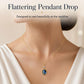 Gold-tone pendant necklace with oval blue stone drop and tiny clear round top