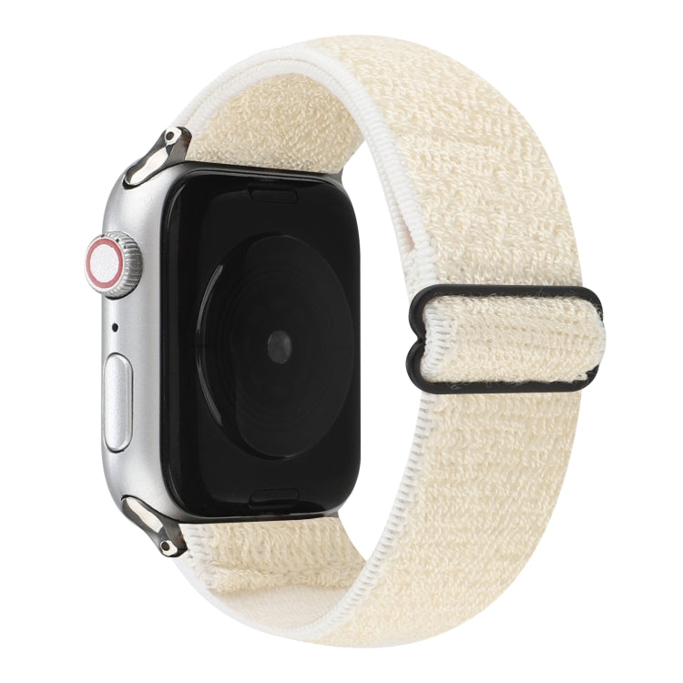 White stretchy nylon Apple Watch band with black hook-and-loop clasp