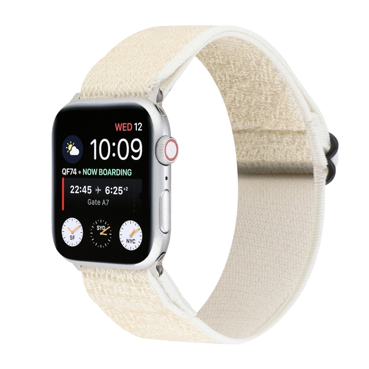 White stretchy nylon Apple Watch band with black hook-and-loop clasp