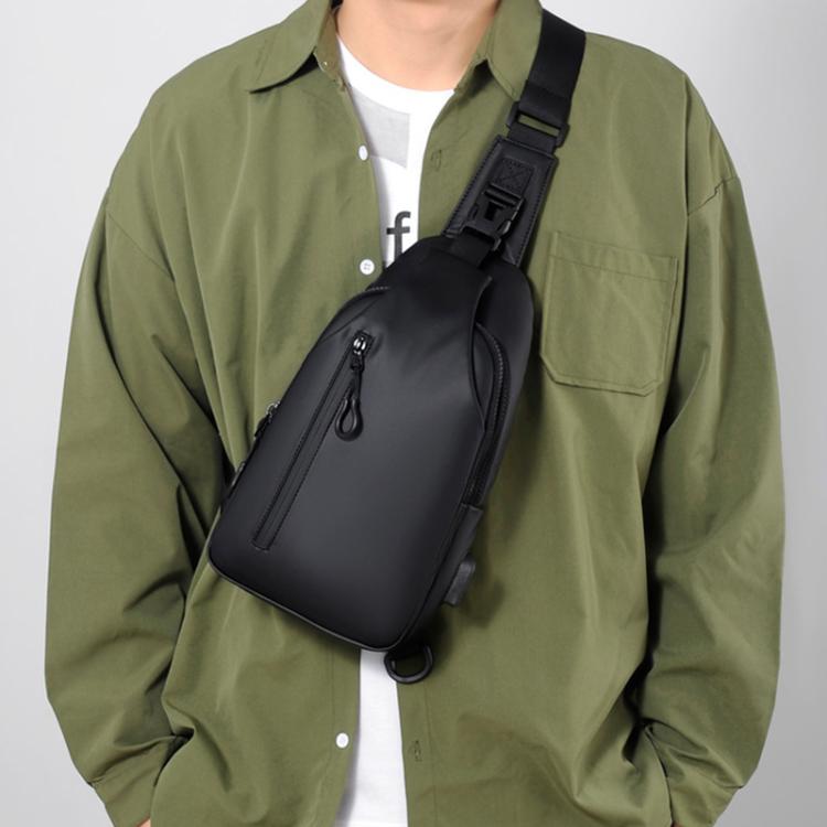 Black crossbody chest sling bag with adjustable shoulder strap and front zip pocket.