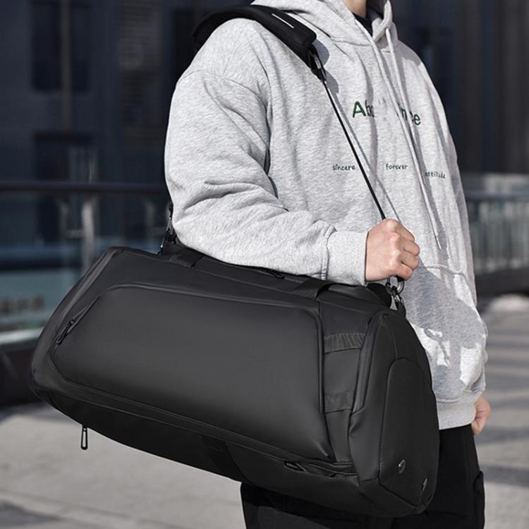 Black fitness crossbody duffel bag with padded shoulder strap and zippered side pocket