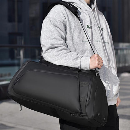 Black fitness crossbody duffel bag with padded shoulder strap and zippered side pocket