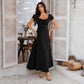 Women's black bubble-sleeve dress with gathered bust and waist, short puff sleeves, A-line