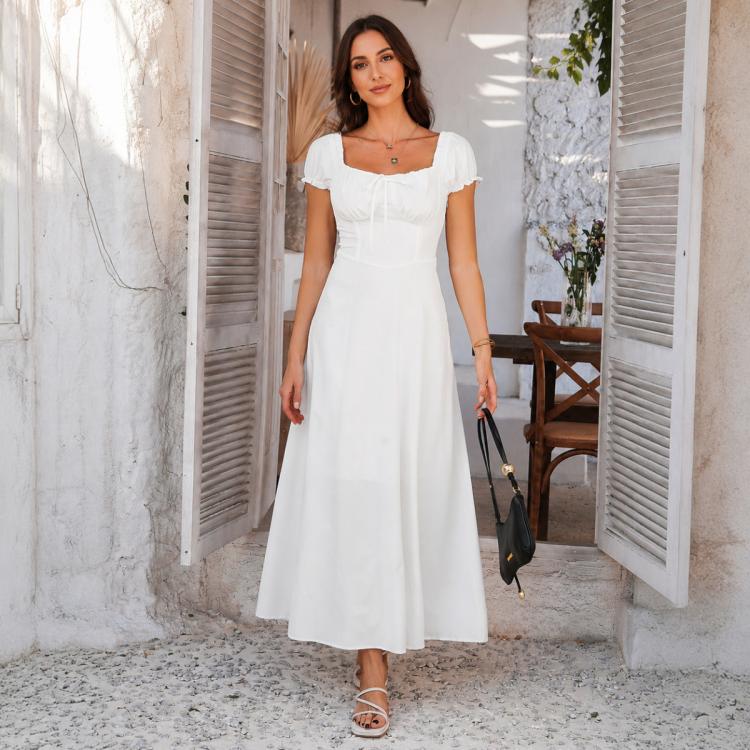 White square-neck bubble-sleeve French midi dress with full skirt, holding a handbag