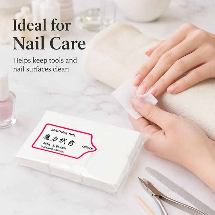Disposable nail and eyelash wipe pad being used to wipe hands near nail tools