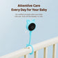 Blue wireless baby monitor camera clipped to crib rail with round lens head