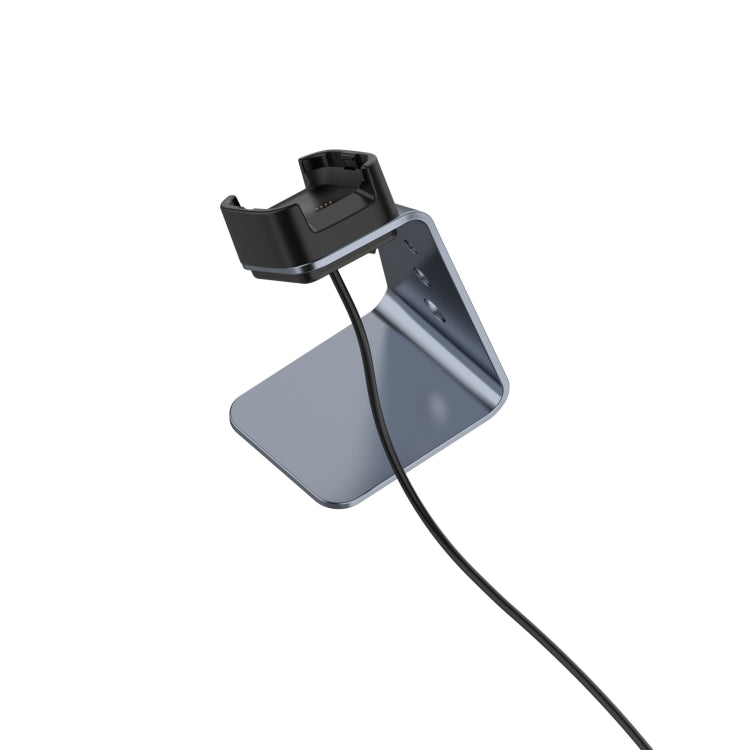 Grey aluminum smartwatch charger holder with black dock and hanging charging cable