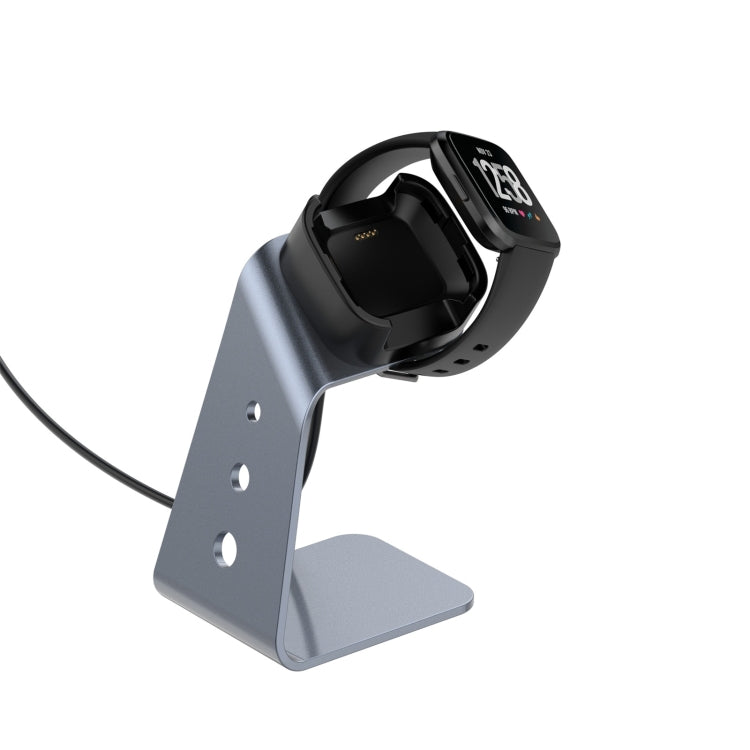 Grey aluminum smartwatch charger holder with black dock and connected charging cable