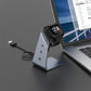 Smartwatch charging on aluminum holder stand with black dock and USB cable