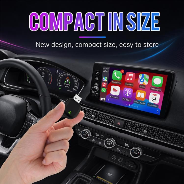 Black compact wireless car adapter held in hand with green power icon