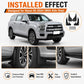 Installed black mud flaps on the vehicle fender area with a side-step fit