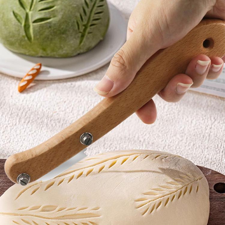 Curved wooden bread scoring tool with metal blade and two fastening screws
