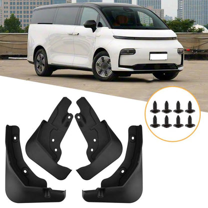 Set of four black car mud flaps with mounting holes and screws