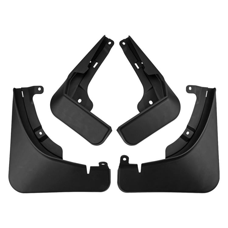Four-piece set of black car mud flaps with mounting tabs and holes
