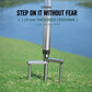 Umbrella ground stake with thick crossbar and three-prong fork base on grass