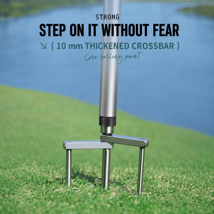Umbrella ground stake with thick crossbar and three-prong fork base on grass