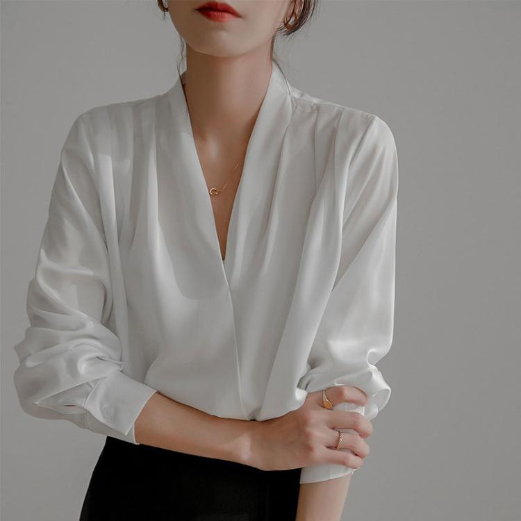 White satin V-neck blouse with long sleeves and soft pleated texture