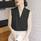 Black satin sleeveless V-neck blouse with smooth drape and minimal collar