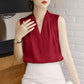 Red sleeveless satin V-neck blouse with draped pleats at the front