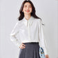 Women's satin long-sleeve blouse, white, pointed collar and button front (angled view)