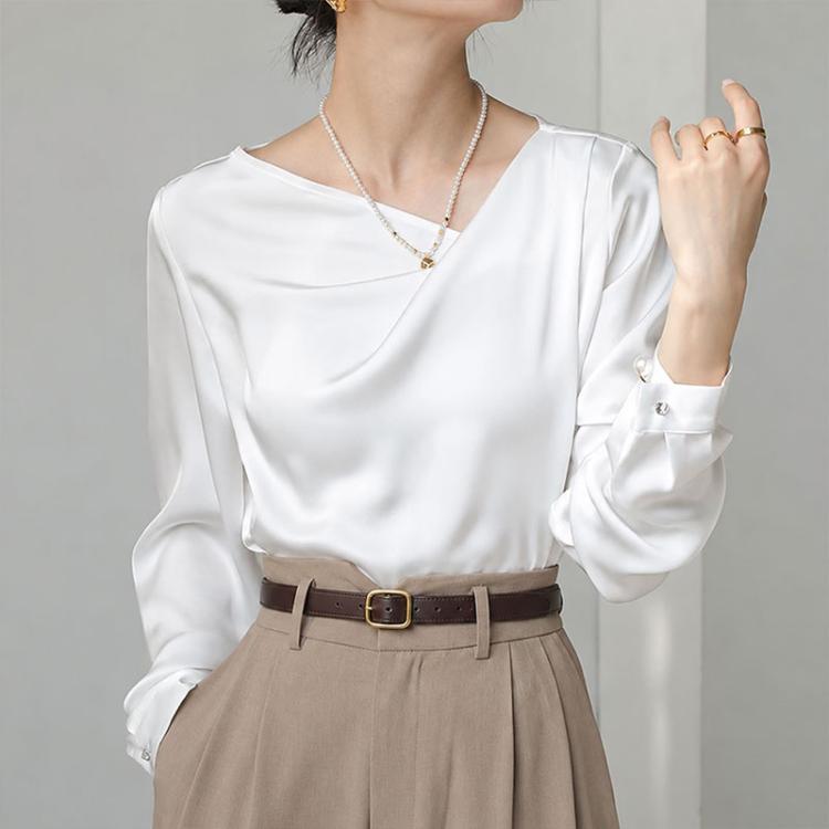 White satin blouse with diagonal V-neck, long sleeves with buttoned cuffs
