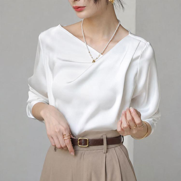 White diagonal V-neck satin blouse with long sleeves, soft drape front