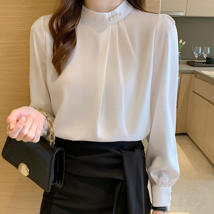 Cream chiffon mock neck blouse with pearl button neckline and long sleeves