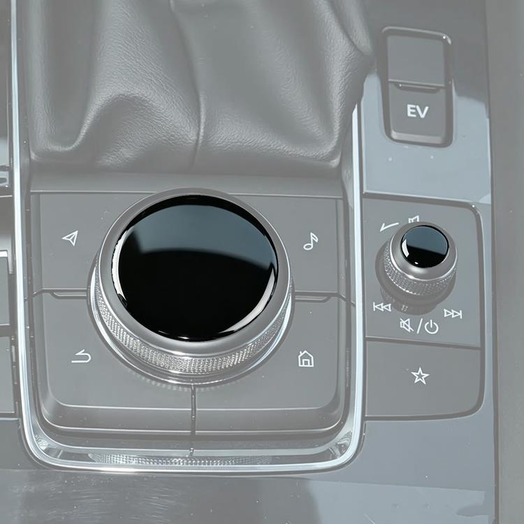 Installed car multimedia knob sticker on center console: black insert with chrome ring