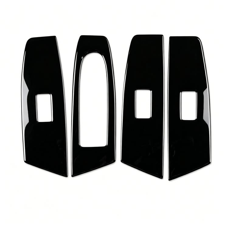 Four glossy black window lift panel covers with rectangular switch openings
