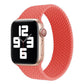 Coral red woven silicone watch band with smartwatch attached