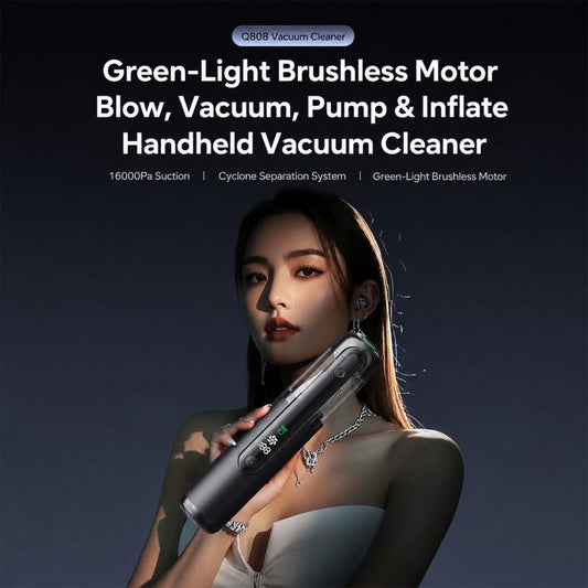 Black handheld vacuum cleaner held in hand for car and home cleaning