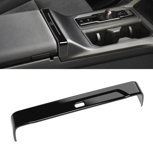 Toyota RAV4 armrest box trim strip in glossy black with center opening detail
