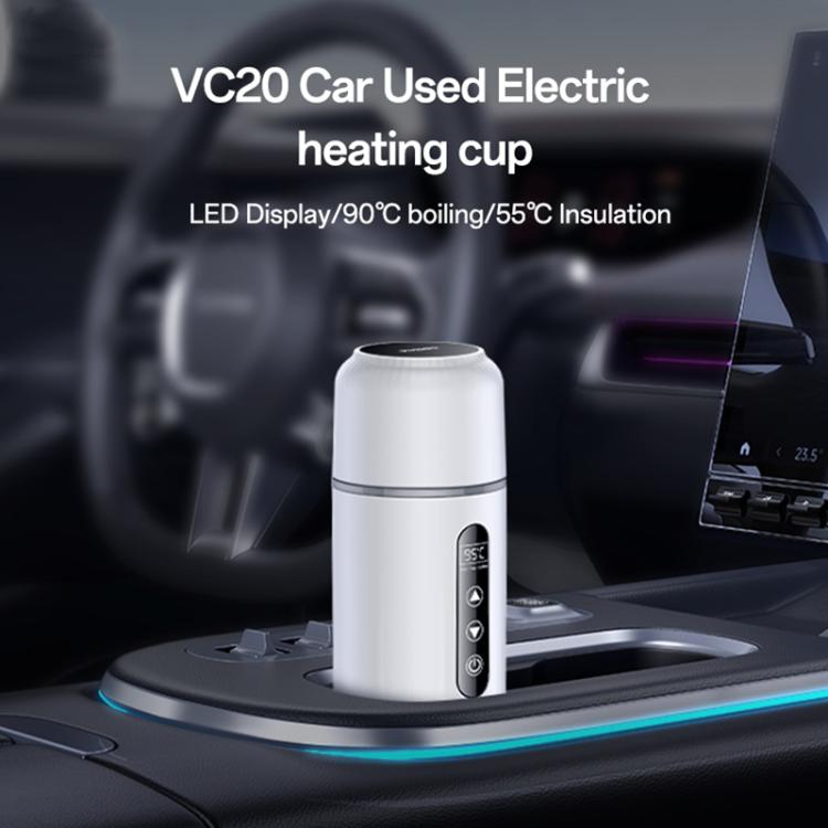 Electric car heating water cup placed on dashboard, white body with LED control panel