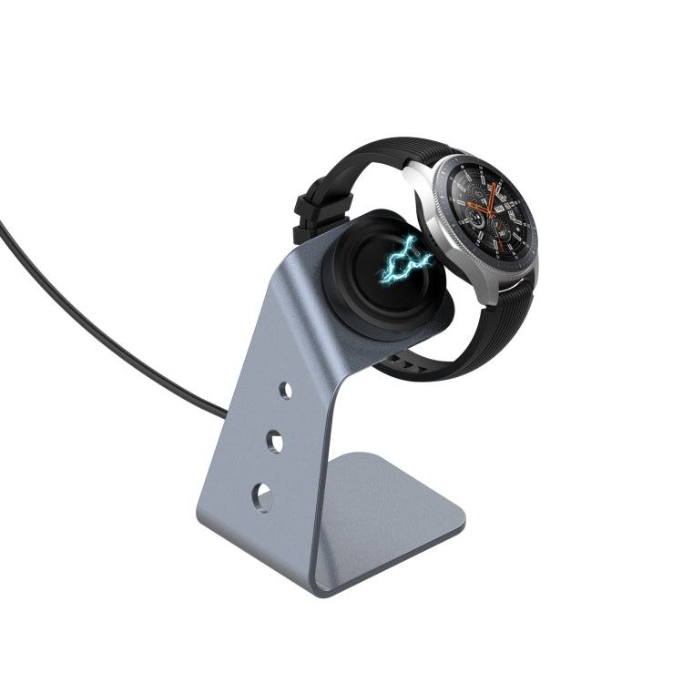 Grey magnetic charger holder supporting a smartwatch on the circular dock