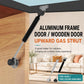 Cabinet gas strut lift support installed on a wooden door with aluminum frame