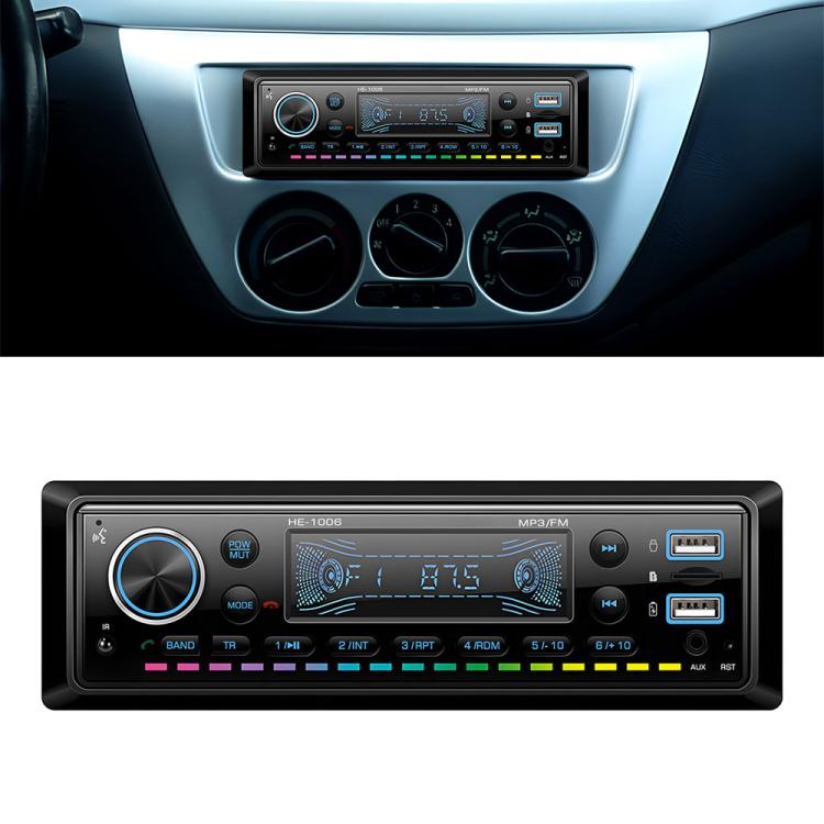 Single-DIN car audio head unit with large volume knob, FM tuner display, USB ports