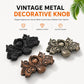 Set of butterfly-shaped metal pull handles in black, bronze, and copper finishes