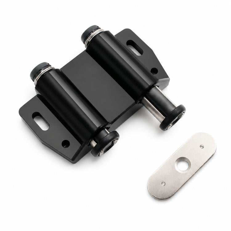 Black handle-free cabinet door latch with metal mounting plate and striker pad