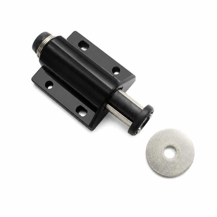 Black handle-free cabinet door latch with round metal striker and mounting plate