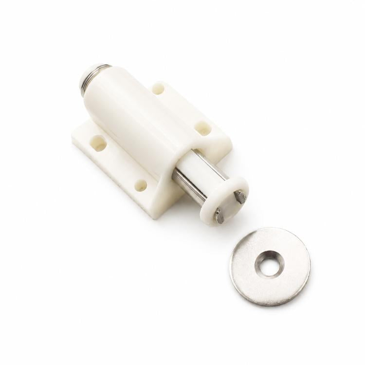Beige handle-free cabinet door latch with round metal striker and mounting plate