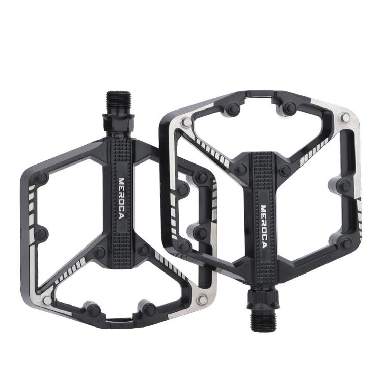 Black mountain bike pedals with dual platform and serrated grip surfaces