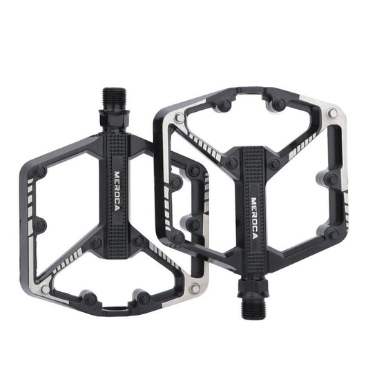 Black mountain bike pedals with dual platform and serrated grip surfaces