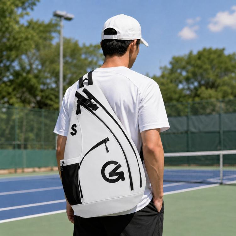 Color-block sports crossbody bag in white with black panels and zipper pockets