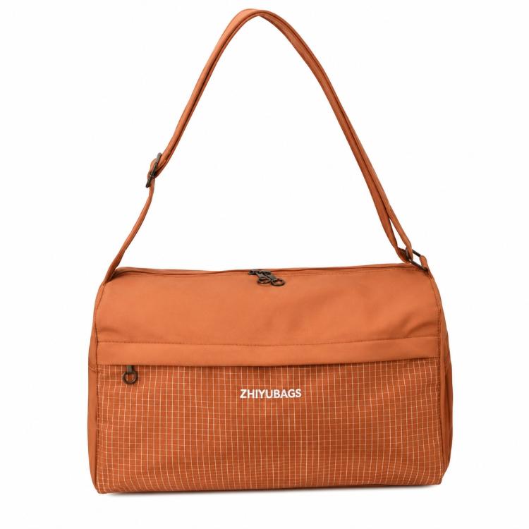 Orange grid-panel crossbody gym handbag with top handle straps and zipper closure