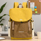 Lightweight canvas backpack with front flap, yellow top and brown front panel, side cords