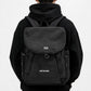 Lightweight canvas backpack with front flap, black colorway, side straps and hooks