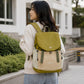 Yellow-green and beige backpack with front flap and side cords