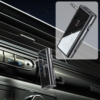 Black 3.5mm AUX Bluetooth adapter with RX/TX ports and angled 3.5mm plug
